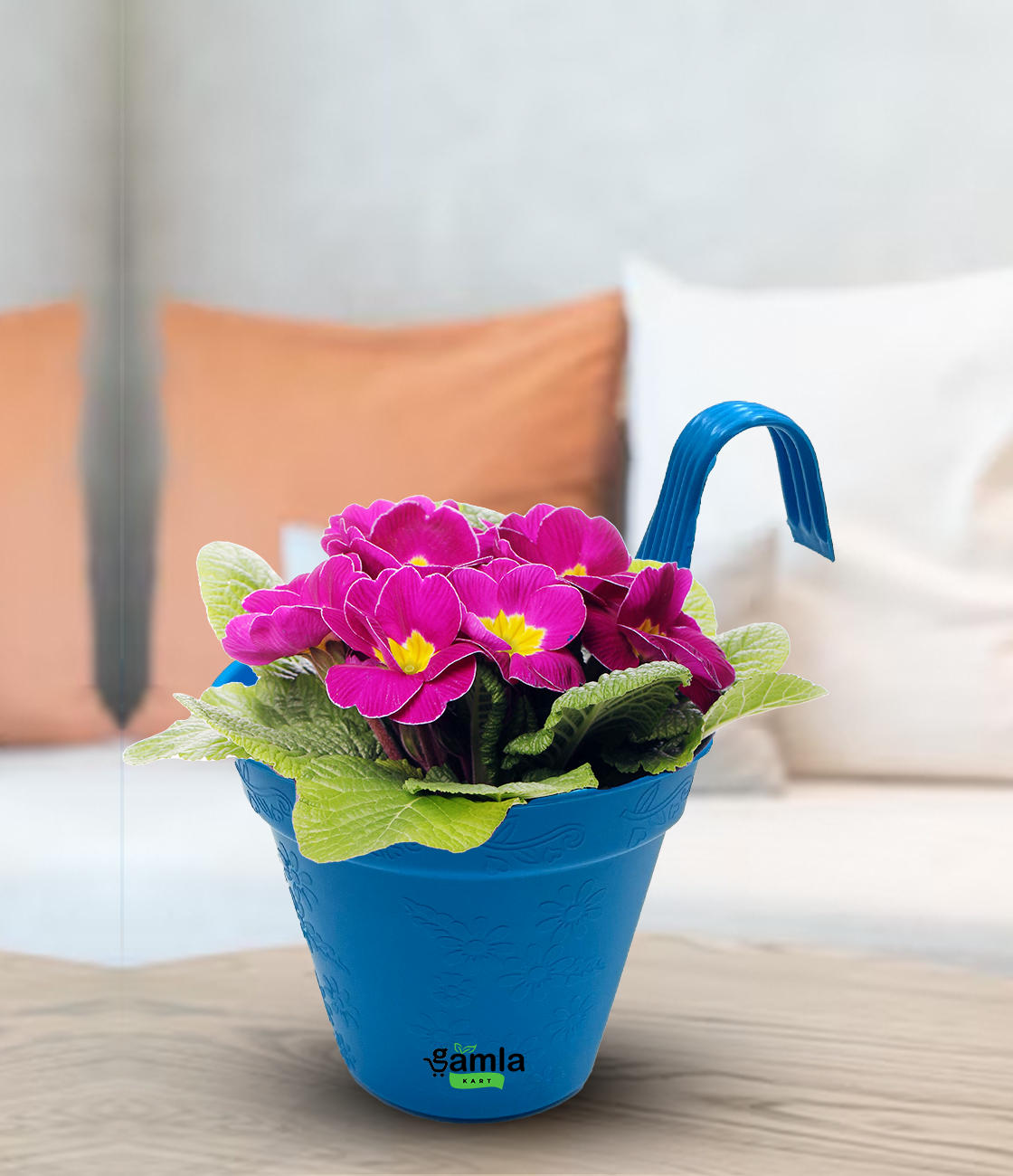 a blue vase filled with pink and purple flowers 